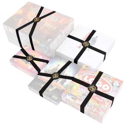 Six board game boxes, each secured with black elastic bands and a gold clasp, on a white background
