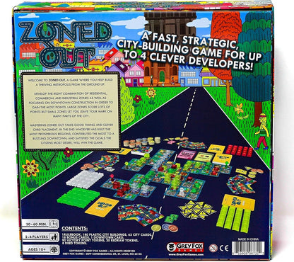 Back of "Zoned Out" board game box featuring a cartoon city at the top and its vibrant plastic building components laid out below.