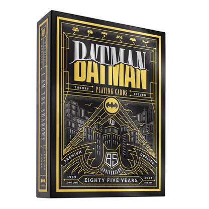 Black and gold Batman 85th Anniversary playing card deck box, featuring the Gotham skyline and logo
