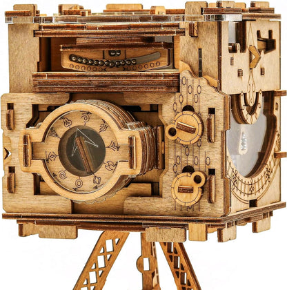 Intricate wooden mechanical Sherlock's Camera model kit with engraved dials, clear windows, and visible moving components on a stand