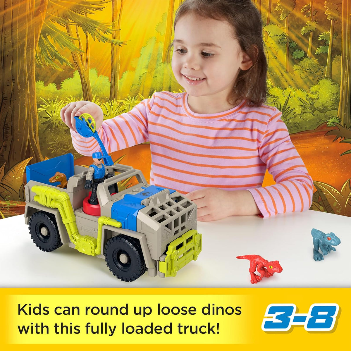 Smiling girl plays with a toy dino capture truck, operating its crane. Small red and blue dinosaurs are nearby.