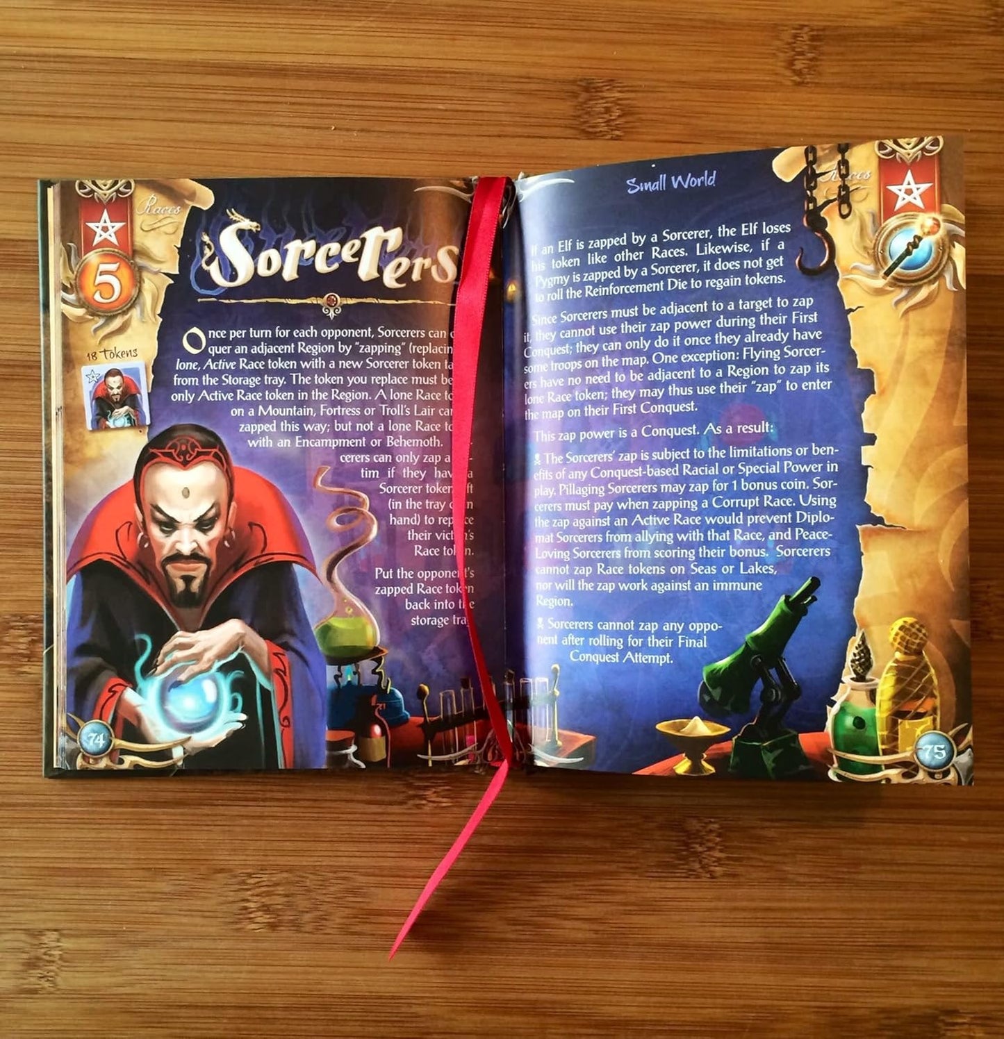 Open box of Small World showing game board, tokens, and insert trays