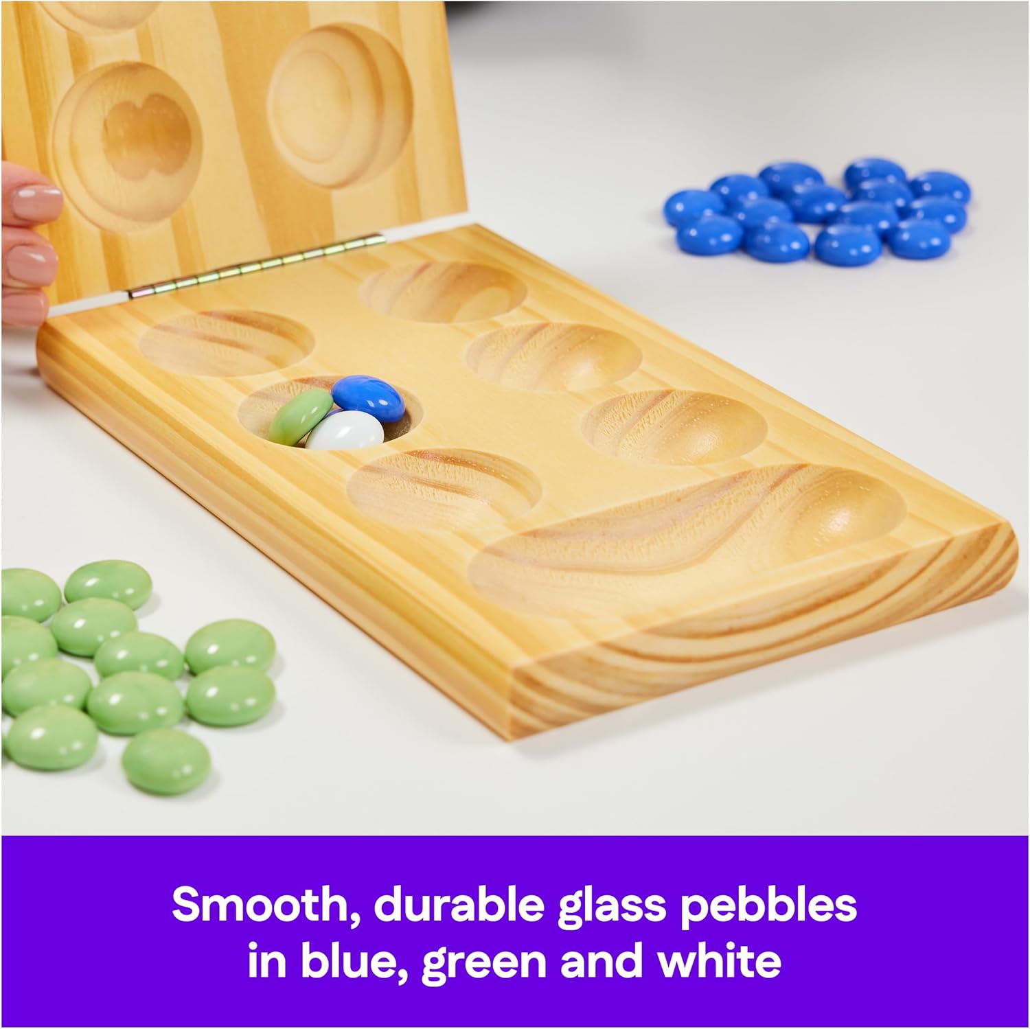 Wooden Mancala board game with colorful blue, green, and white glass pebbles