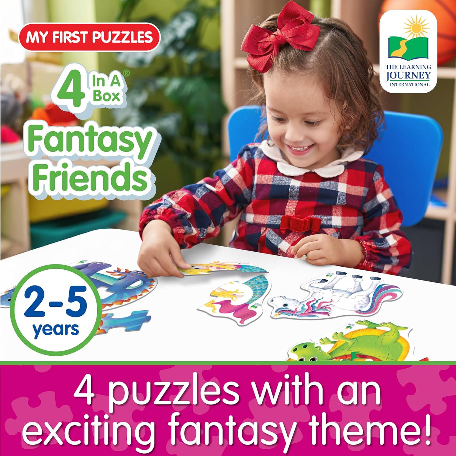 Happy child playing with four colorful fantasy puzzles (dragon, unicorn, mermaid)