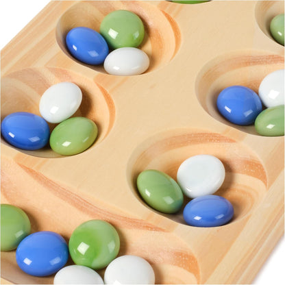 Wooden Mancala board pits filled with blue, green, and white glass marbles