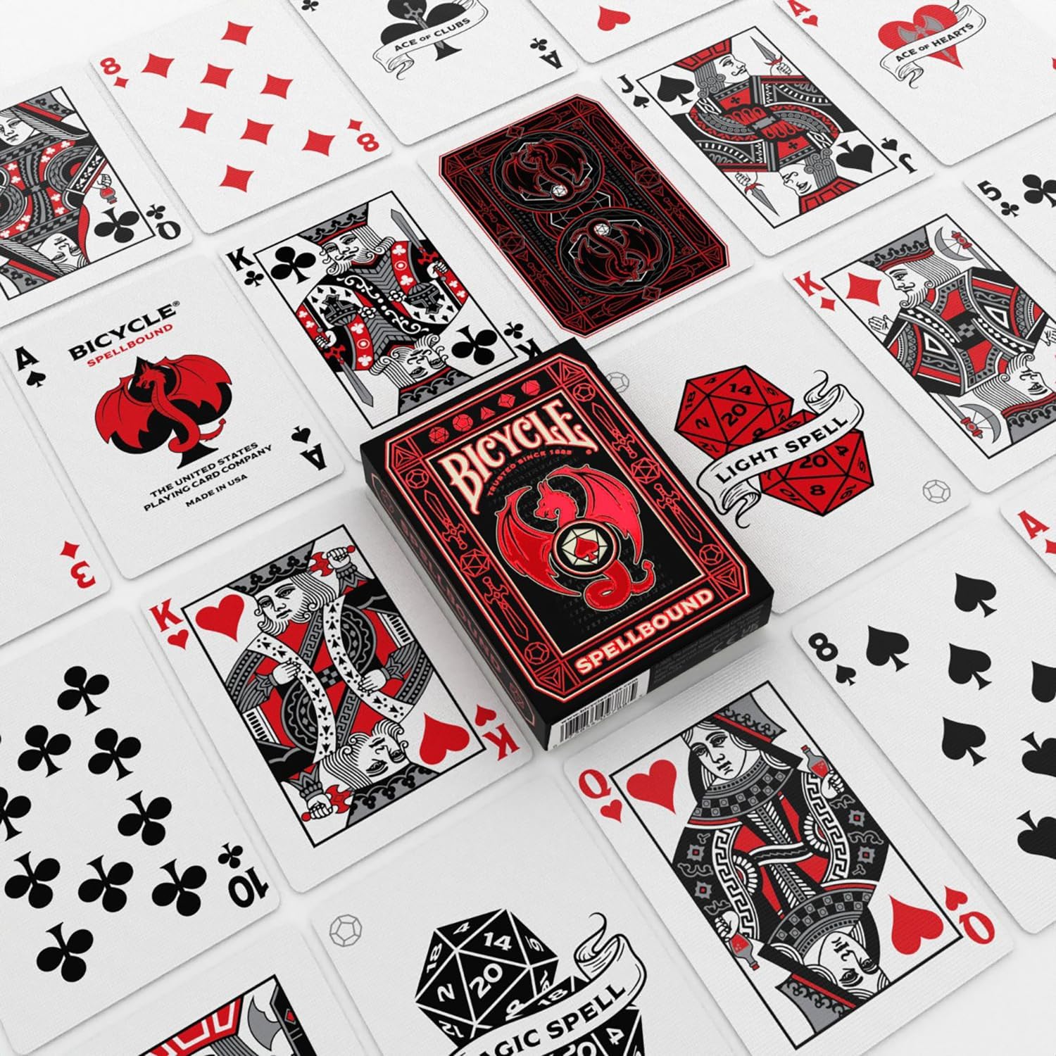 Custom red and black Bicycle Spellbound playing cards spread around the matching dragon tuck box