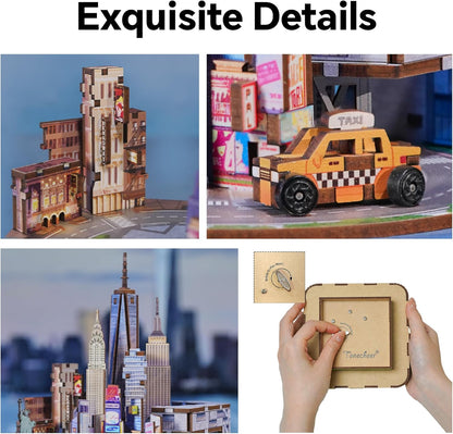 Detailed wooden 3D puzzle music box showing miniature New York City buildings, a taxi, and the base winding mechanism