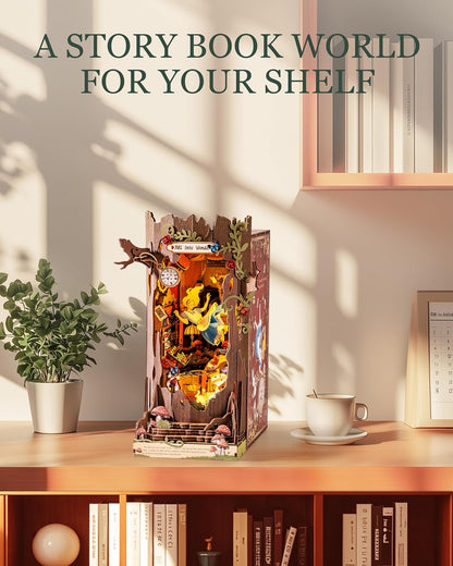 Illuminated Alice in Wonderland book nook showing Alice falling down a rabbit hole, displayed on a wooden shelf