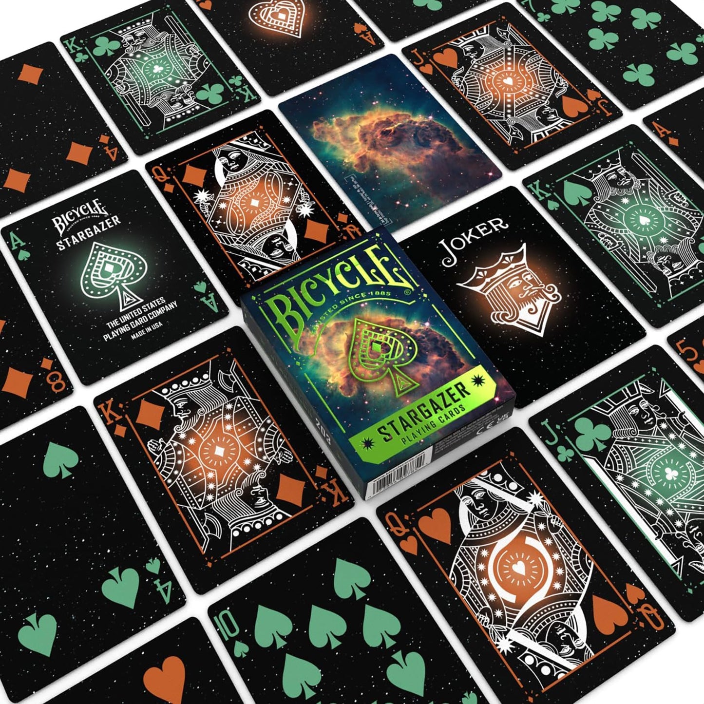 Display of Bicycle Stargazer playing cards set, featuring black cards with glowing orange and green cosmic art