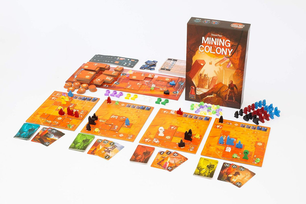 The board game "Mining Colony" is displayed with its box, multiple orange boards, and various colourful meeples and tokens