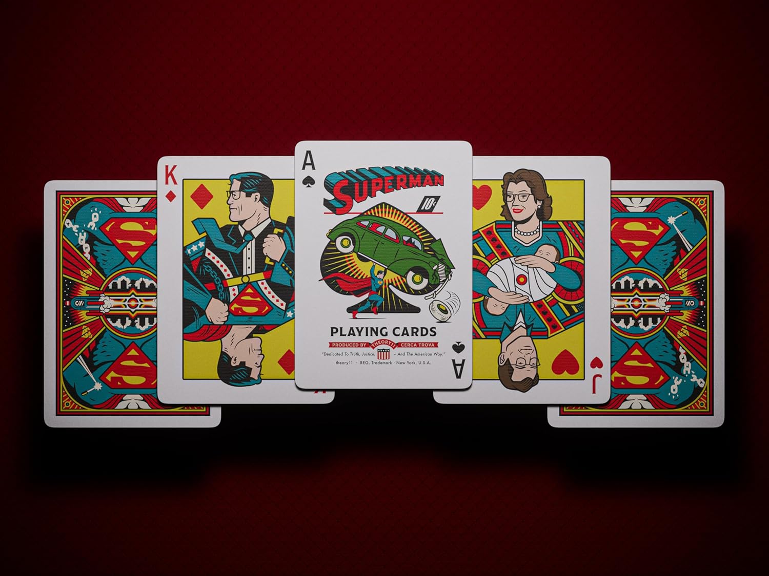 Five custom Superman playing cards. Center card, the Ace of Spades, shows Superman lifting a green car