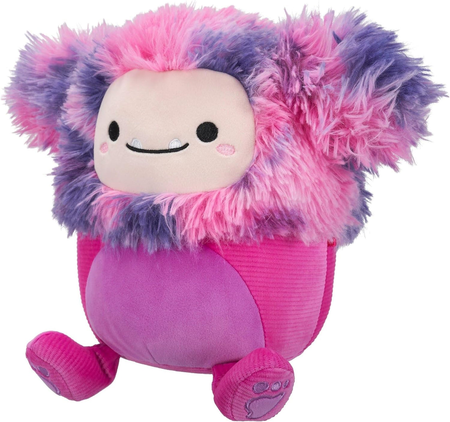 Shaggy pink and purple monster plush with a round body and a smiling face showing small fangs