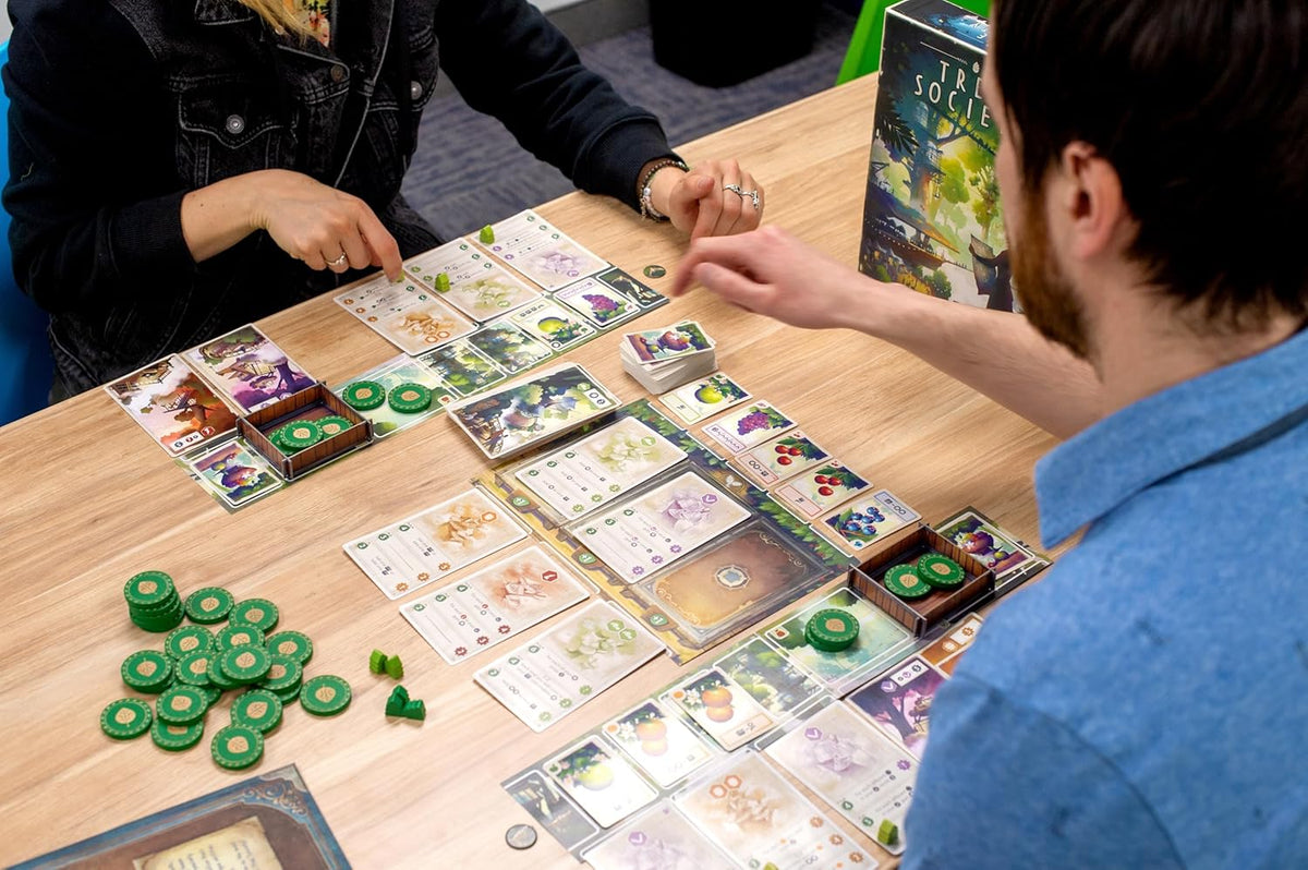 Game box with cards and player tokens arranged neatly