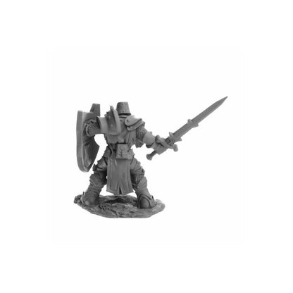 Unpainted miniature of an armoured knight holding a sword and shield on a rocky base