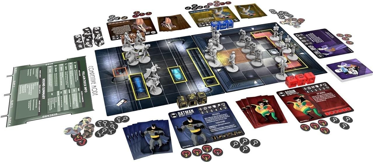 Batman The Animated Series Adventures – Shadow of the Bat board game laid out with miniature figures, character cards for Batman, Robin, and villains, dice, tokens, and game sheets