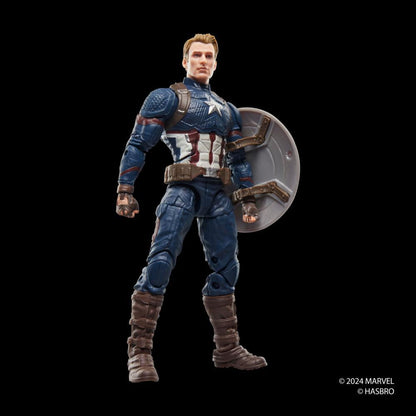 A Marvel Legends Series Captain America Action Figure stands in a blue, red, and white suit with a shield on its back against a black background