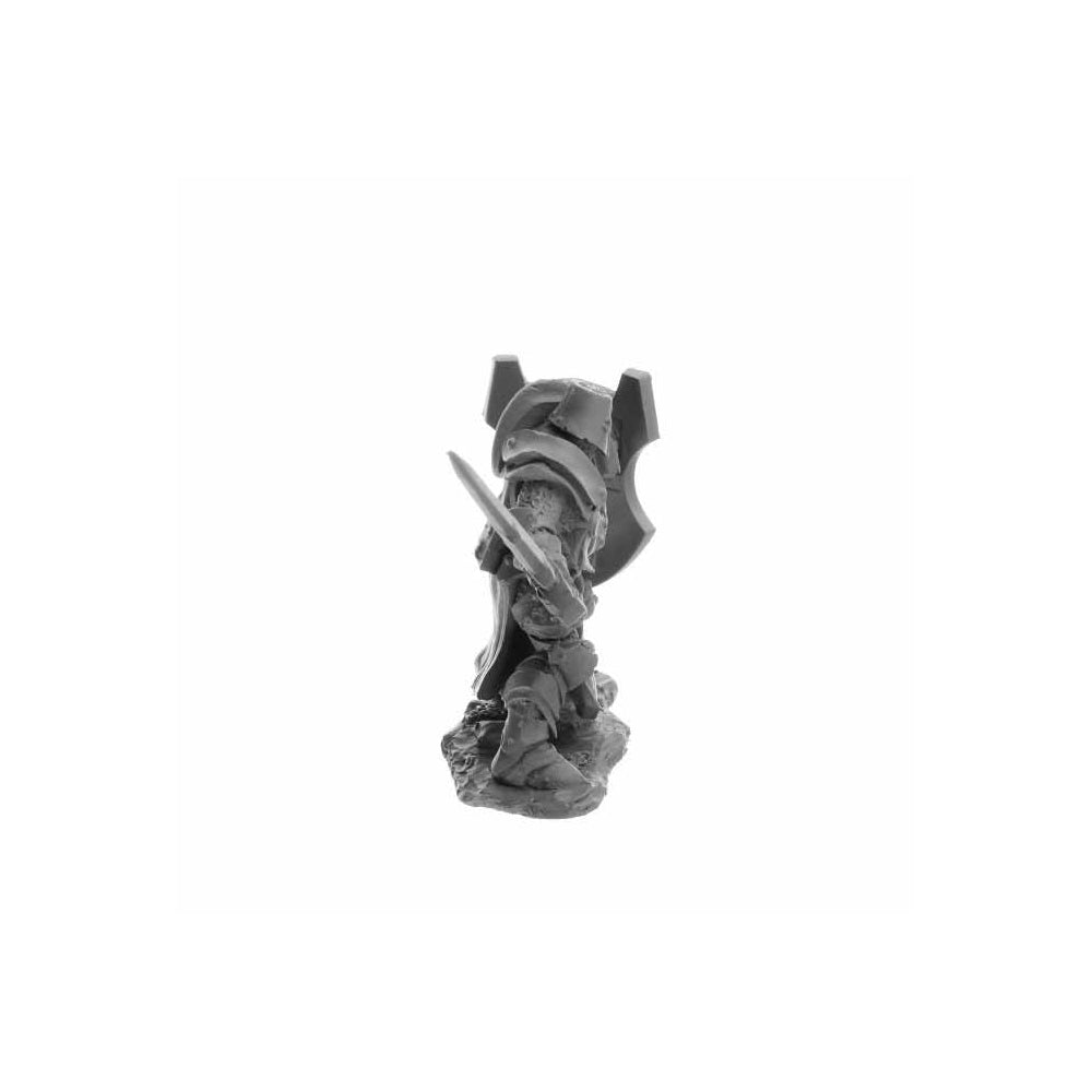 Unpainted miniature of a heavily armoured warrior/knight holding a sword and shield