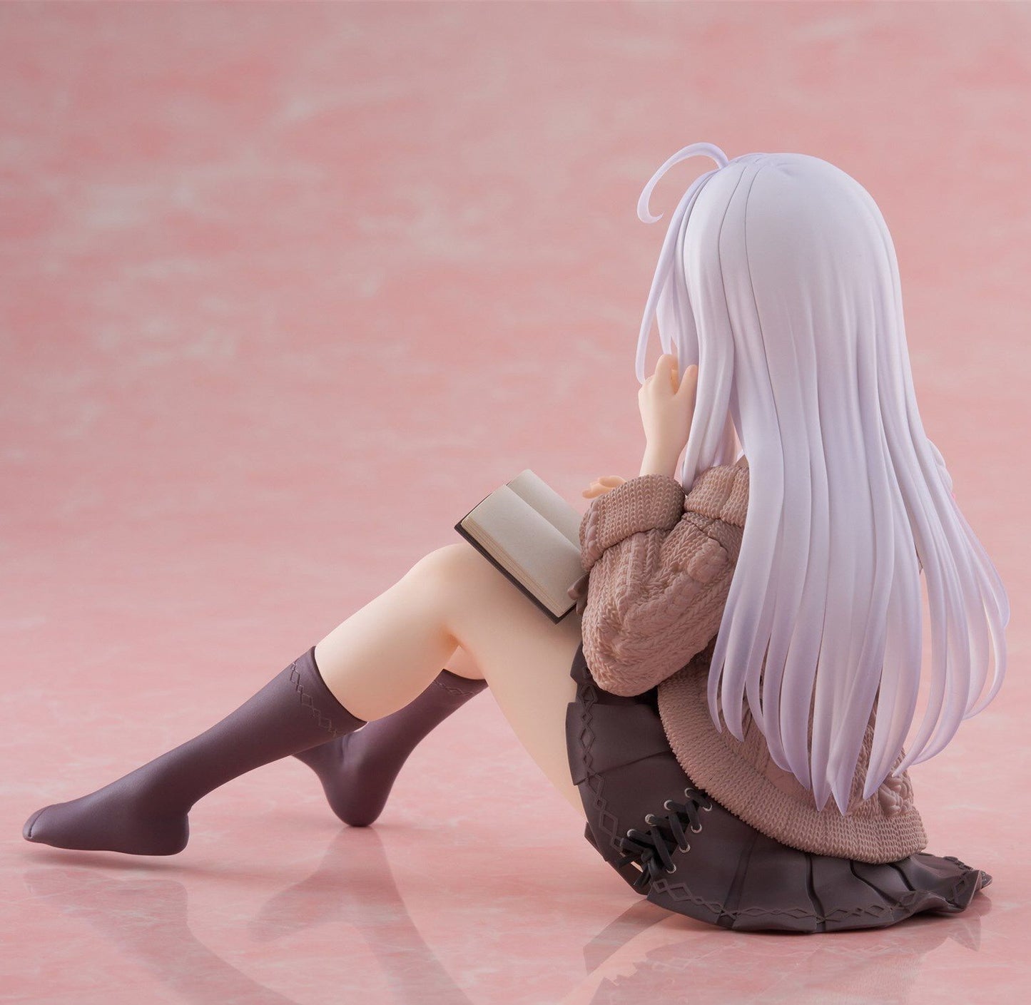 Close-up of Elaina smiling in casual outfit