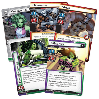 A close-up shows several French Marvel Champions cards fanned out on a white background featuring Miss Hulk, Taskmaster, and Atlas