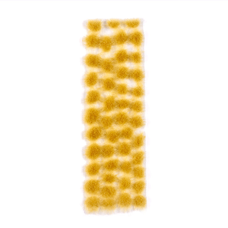 A strip of dense yellow-gold autumn tufts, 4mm, arranged in clusters against a white background