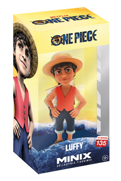 Front view of Luffy figure grinning widely, wearing red open shirt, blue shorts, and signature straw hat