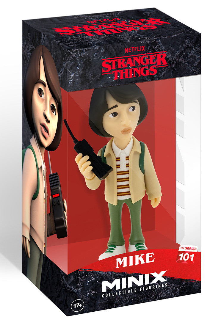 Front view of Mike Wheeler figure with brown layered hair, striped retro shirt, and open hand gesture