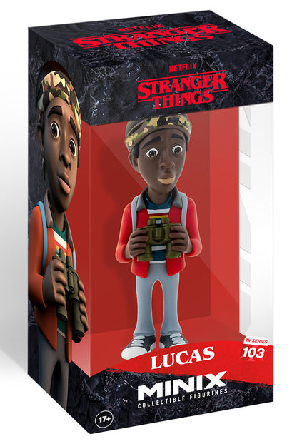 Stranger Things Lucas Minix collectible figurine detailed in a red jacket blue striped shirt and camouflage hat displayed in its clear box