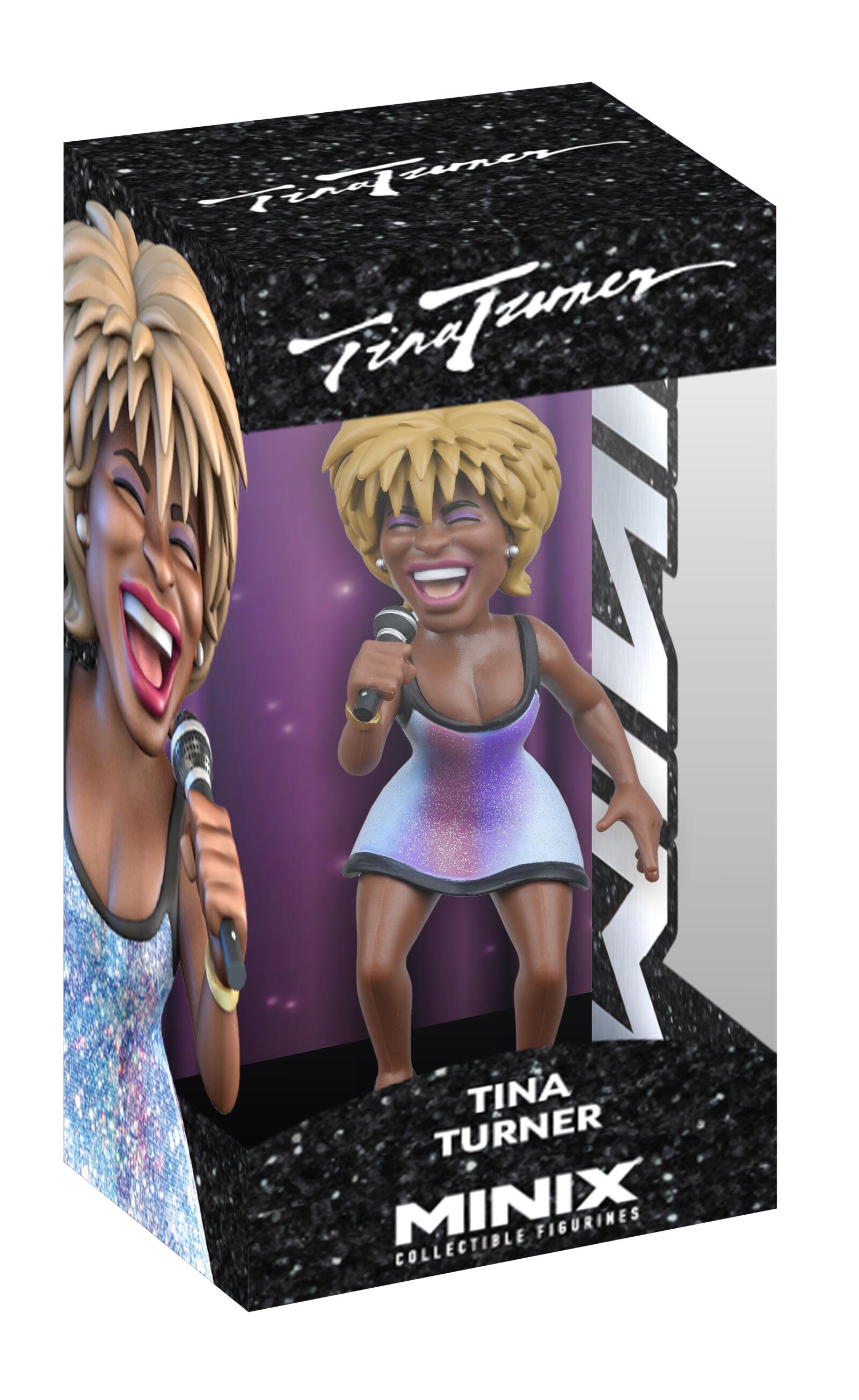 A MINIX Tina Turner collectible figure displayed in a black box with a clear window, depicting a smiling Tina with spiky blonde hair, a sparkly purple and white ombre dress, and a microphone