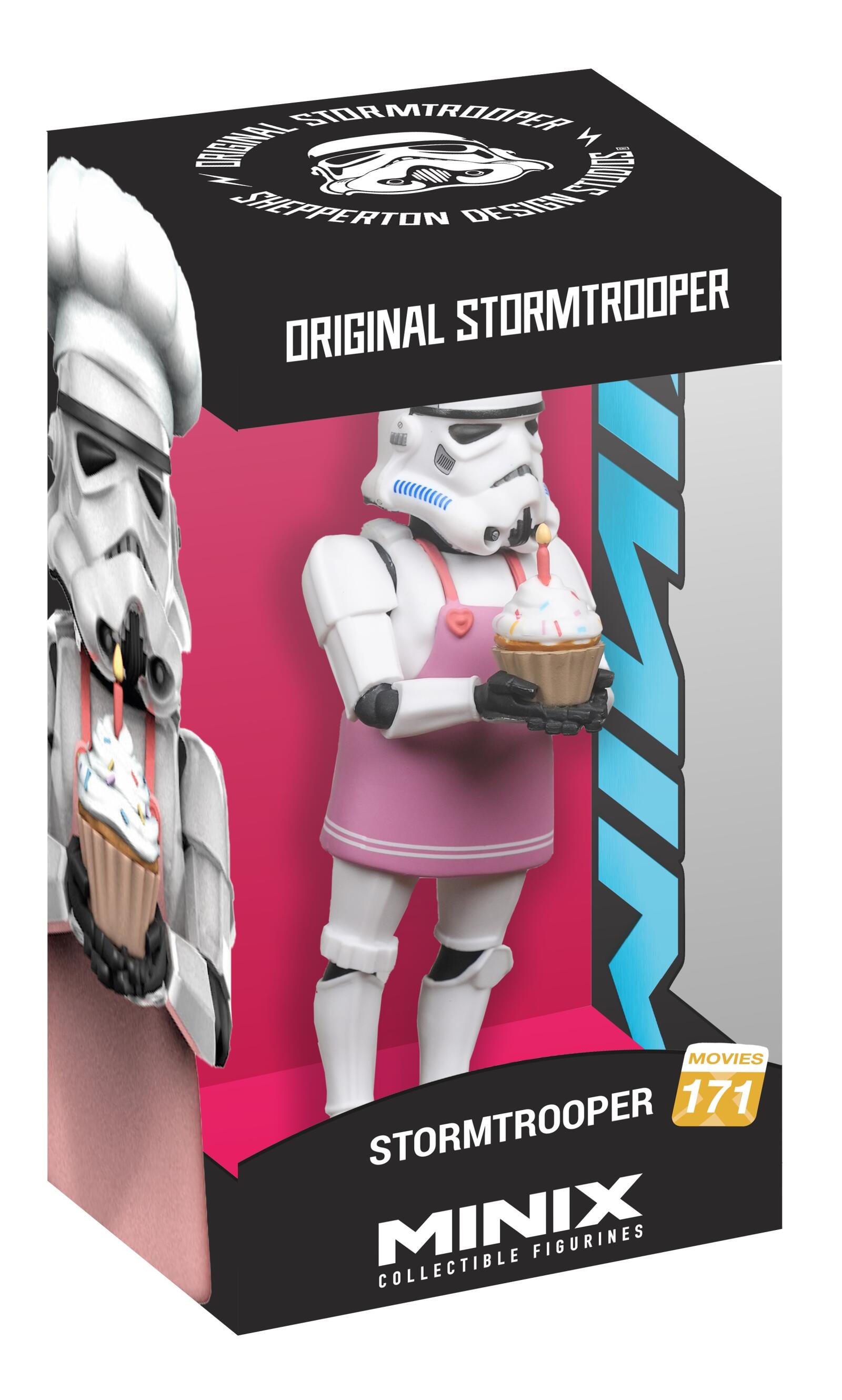 A MINIX Star Wars Original Stormtrooper figure in a pink apron holds a lit birthday cupcake, packaged in a black and pink window box with a chef-hat Stormtrooper depicted on the side