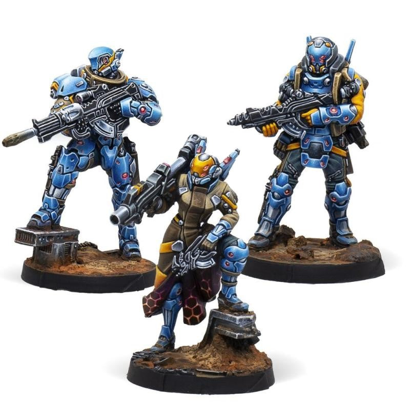 Three painted sci-fi miniature figures, two in blue armor standing with rifles, one in brown and blue armor crouching with a rifle, all on textured bases