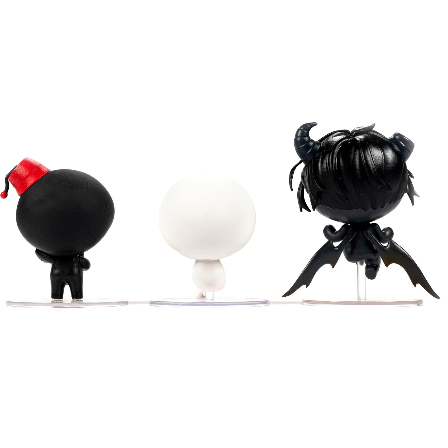 Three The Binding of Isaac collection figures: a black character with a red fez, a white character, and a black demon with horns and wings