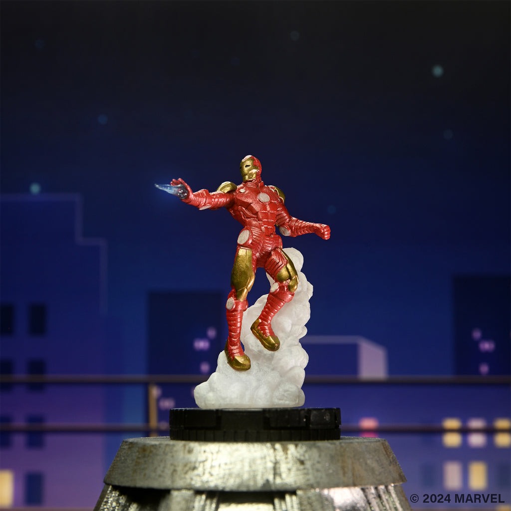 Red and gold Iron Man figure launching with a blue repulsor blast, against a dark city night sky