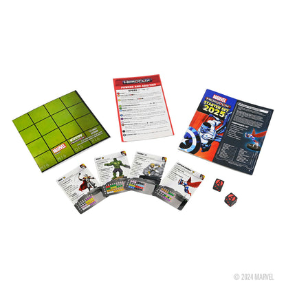 A Marvel HeroClix Starter Set 2025 displayed with a green grid board, rulebooks, character cards with miniature figures, and two dice