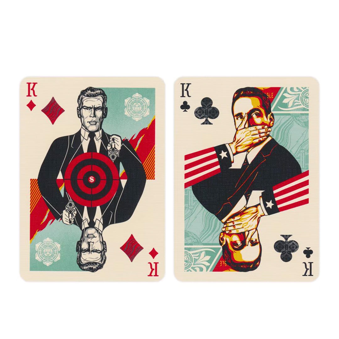 Two Obey King playing cards: one shows a target on a man with guns, the other shows a silenced man