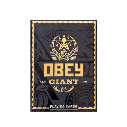 Black and gold Obey Giant playing card deck box, featuring the brand's star logo and bold typography