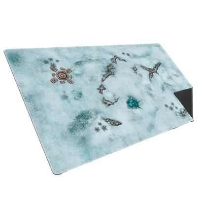 The snowy side of a game playmat depicts a cold, desolate terrain with central ruins, exposed rocks, and a prominent bright blue ice feature