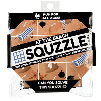 The Fun Squared Games Squzzle Puzzle "At The Beach" is shown in its clear and black retail package, featuring nine squares with beach chairs, starfish, and sunglasses