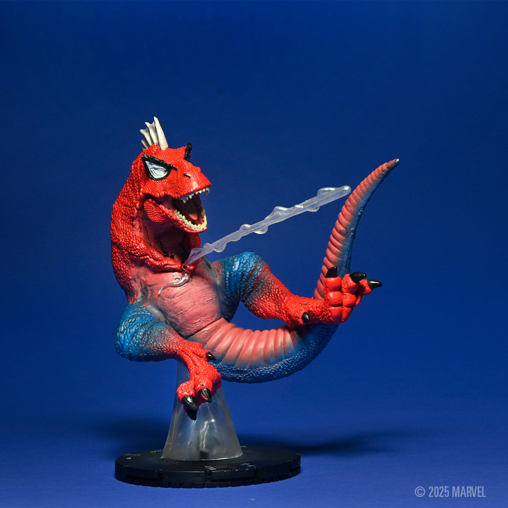 Red and blue Spider-Rex figure roaring with Spider-Man eyes and a mohawk, shooting a white web from its mouth