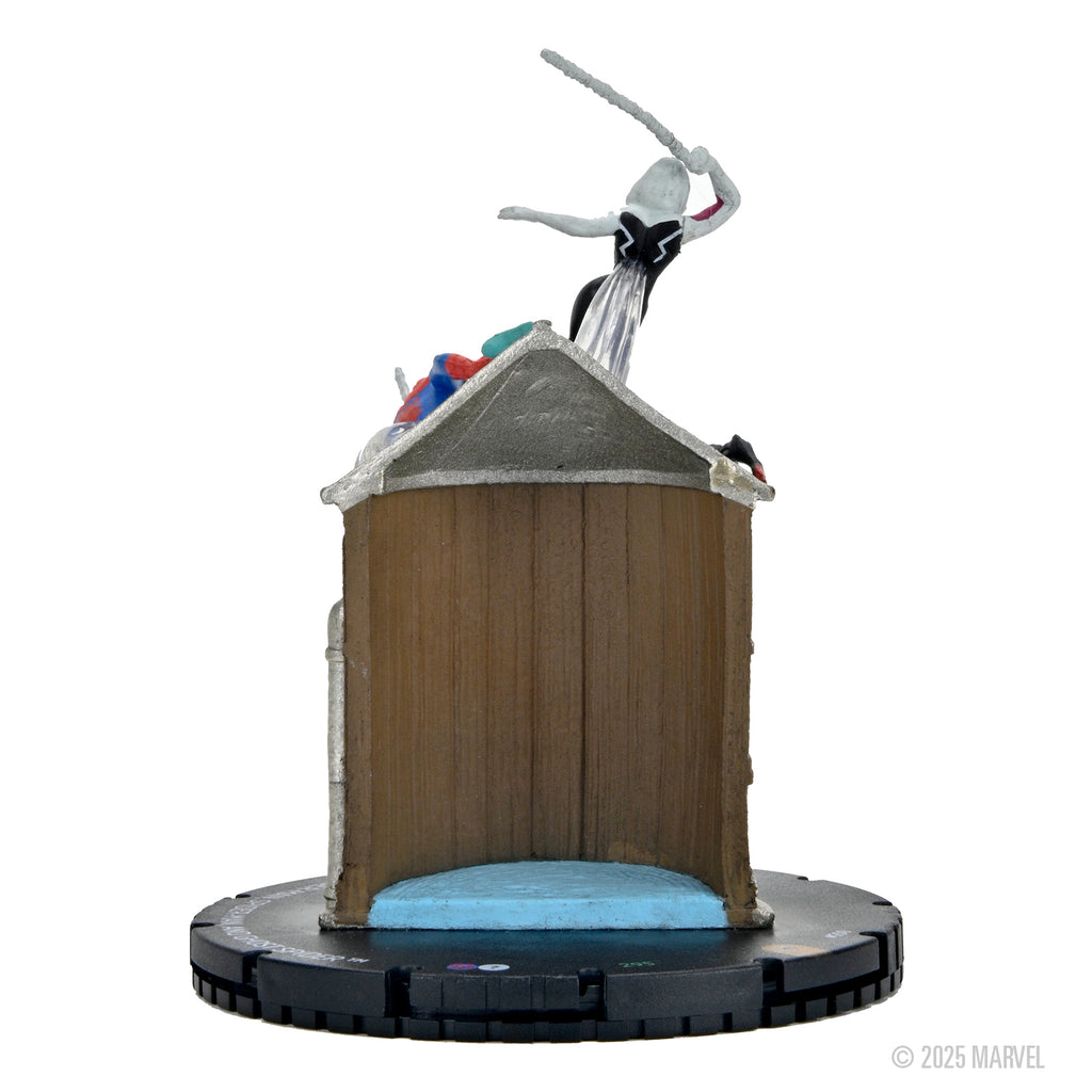 A Marvel HeroClix Spider-Verse Web Warriors Promo figure showing a white and black character with a weapon on a brown building-like structure over a black base