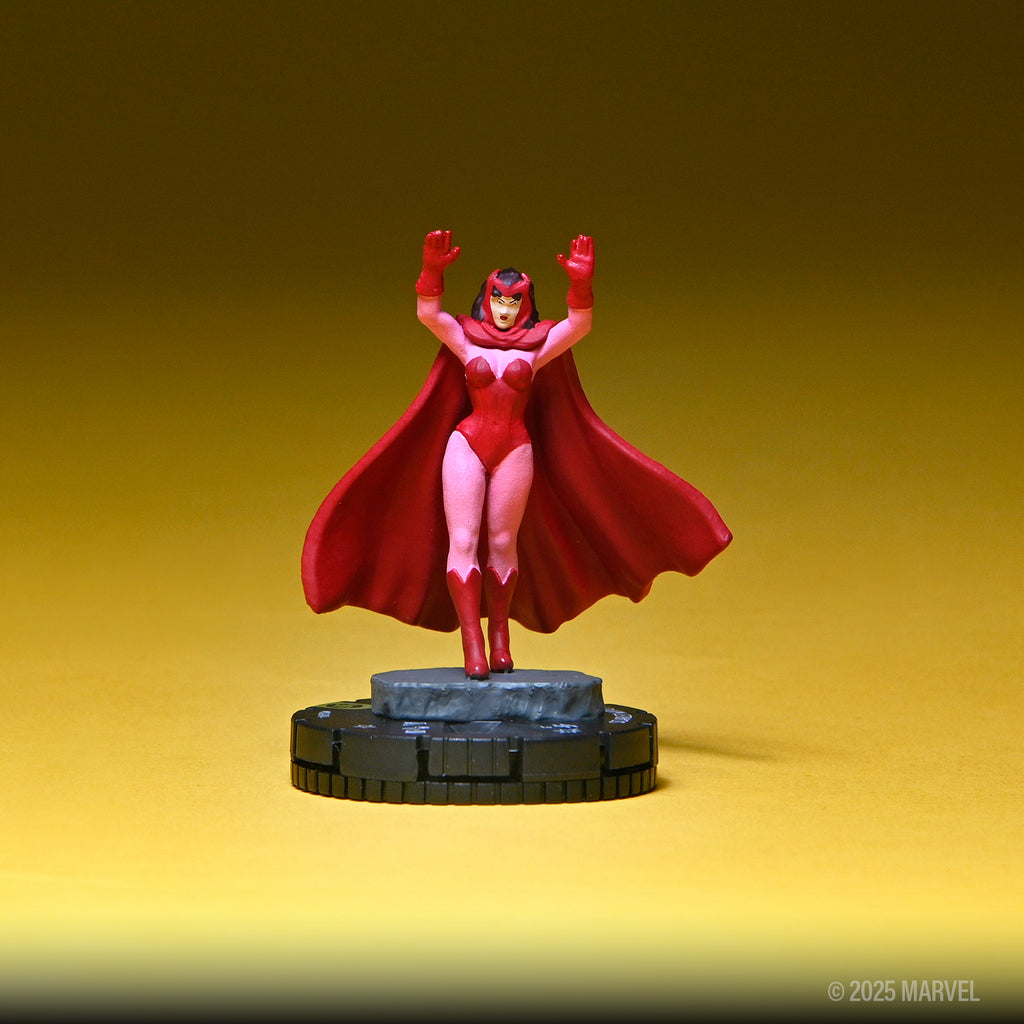 Scarlet Witch miniature figure in red, with raised hands, casting a spell