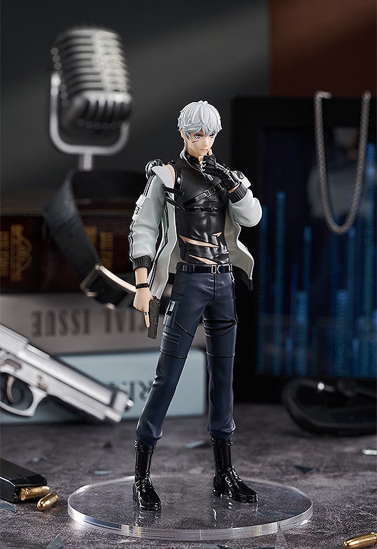 Anime character action figure in a black and white jacket black tactical harness and dark pants holding a pistol