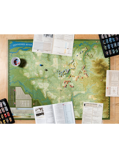 Overhead shot of "Into the Woods: Battle of Shiloh" wargame set up, showing map, game pieces, rulebooks and aids