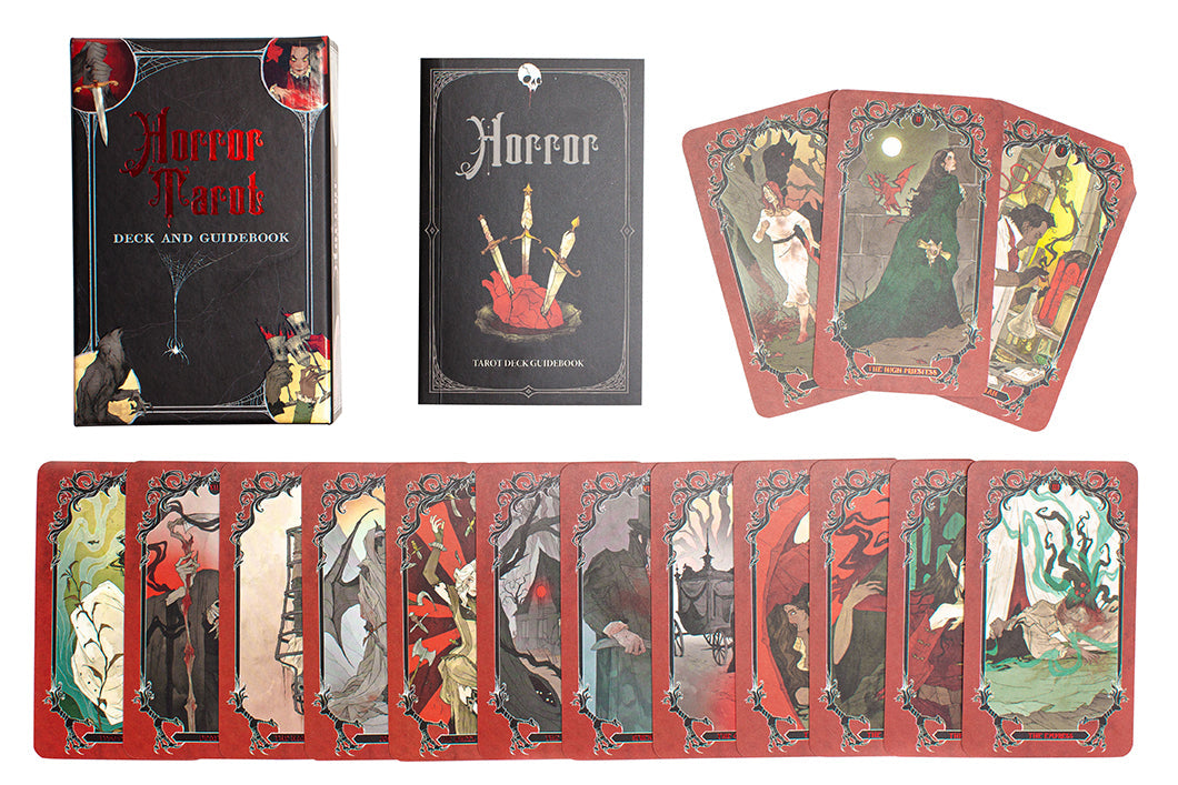 Horror Tarot deck displayed: black box, guidebook, and many red-bordered cards with dark, gothic illustrations