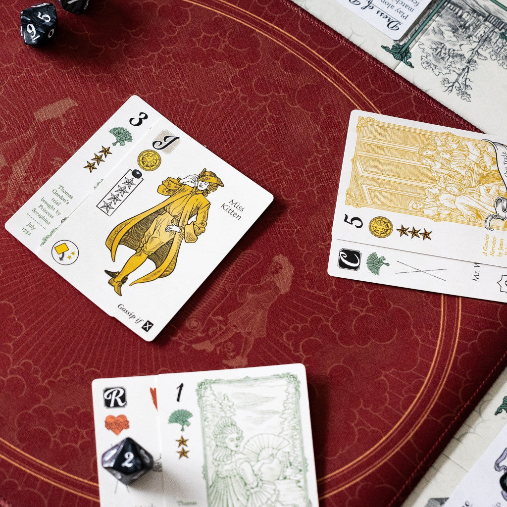 Several historical Molly House game cards, including the character card "Miss Kitten," are spread across a rich, custom burgundy game mat alongside a black numbered die