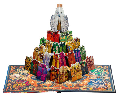 A pop-up Harry Potter advent calendar: Hedwig on top of numbered gift boxes rising from a magical book
