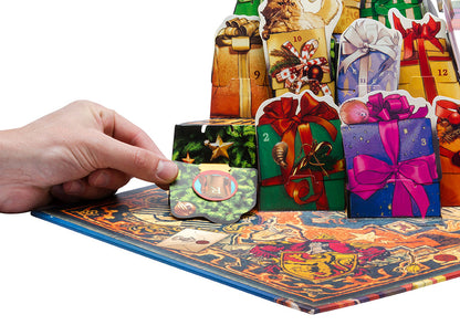 A hand pulls open a Christmas-themed advent calendar door, revealing an 'R' on its inner flap