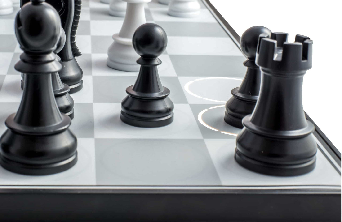The DGT Centaur chess computer board features sleek black chess pieces on light gray and white squares, highlighted by illuminated concentric circles indicating moves