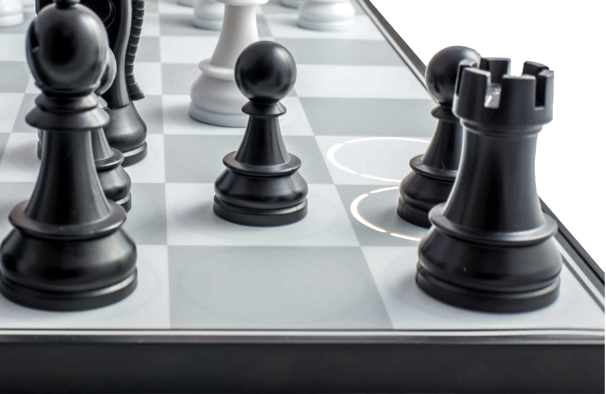 The DGT Centaur chess computer board features sleek black chess pieces on light gray and white squares, highlighted by illuminated concentric circles indicating moves