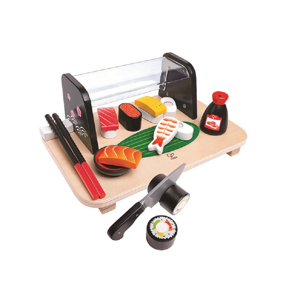 Colorful wooden play sushi set on a tray, including nigiri, maki rolls, a toy knife, chopsticks, and soy sauce