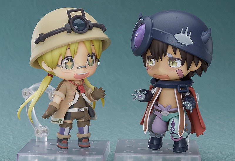 Made in Abyss Nendoroid figures of Riko and Reg standing with display stands